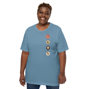 Blue bird t-shirt featuring a posse of show pigeons and describing their specific set of skills on the back of the shirt.. Front of shirt is shown with each pigeon in its own circle down the left side. Worn by a woman.