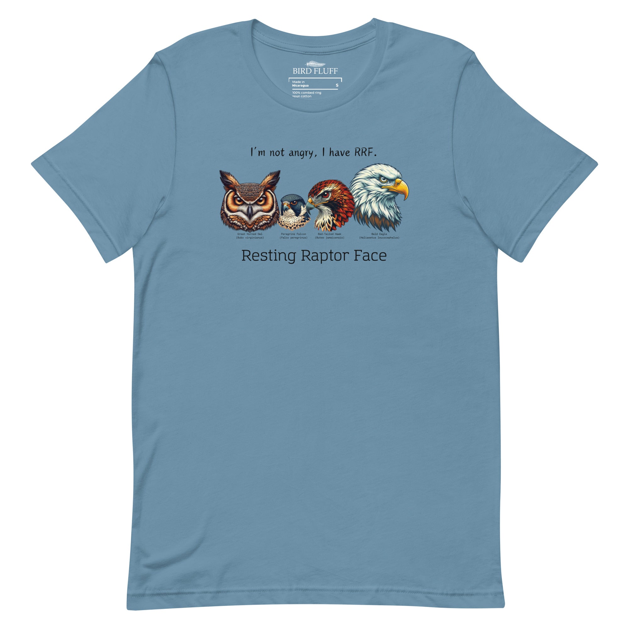 A steel blue bird shirt with a great horned owl, a peregrine falcon, a red-tailed hawk and a bald eagle. The shirt has text that says, I'm not angry, I have RRF. Resting Raptor Face. 