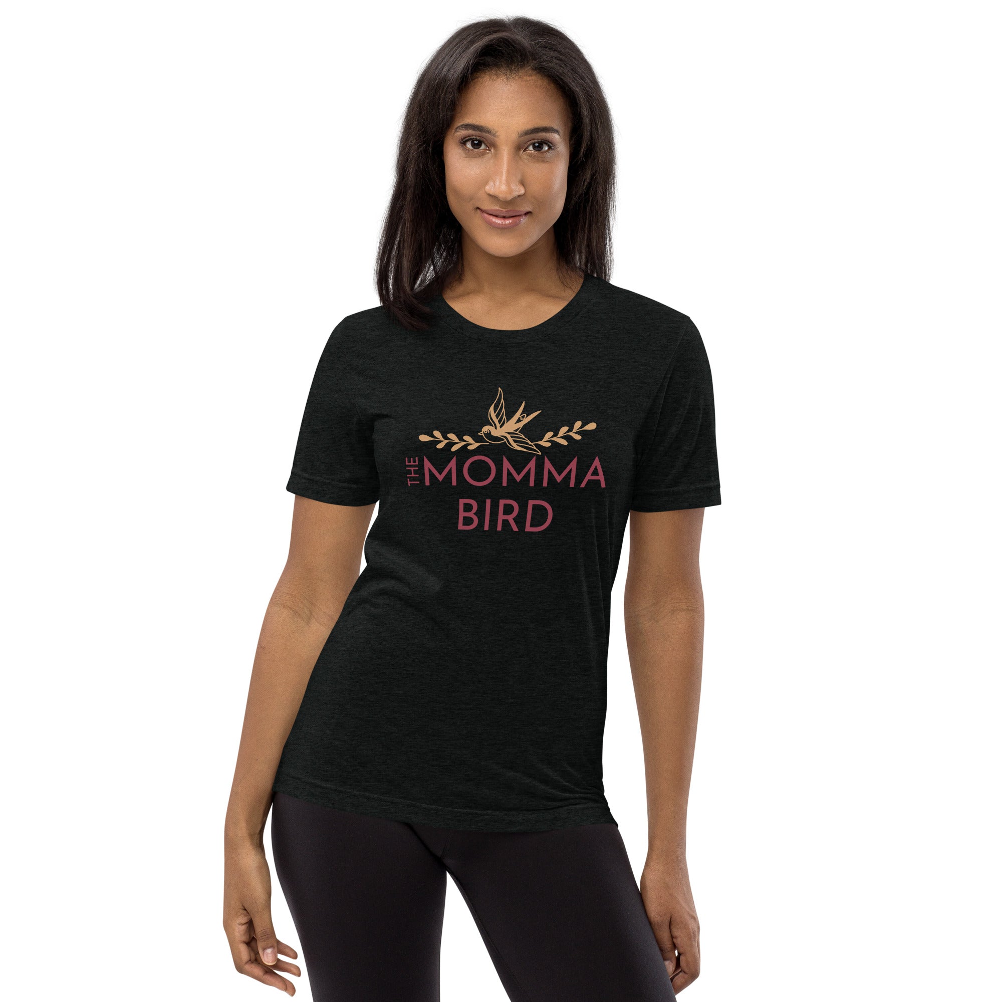 Black premium bird t-shirt with a bird graphic and the words The Momma Bird on the front, worn by female model.