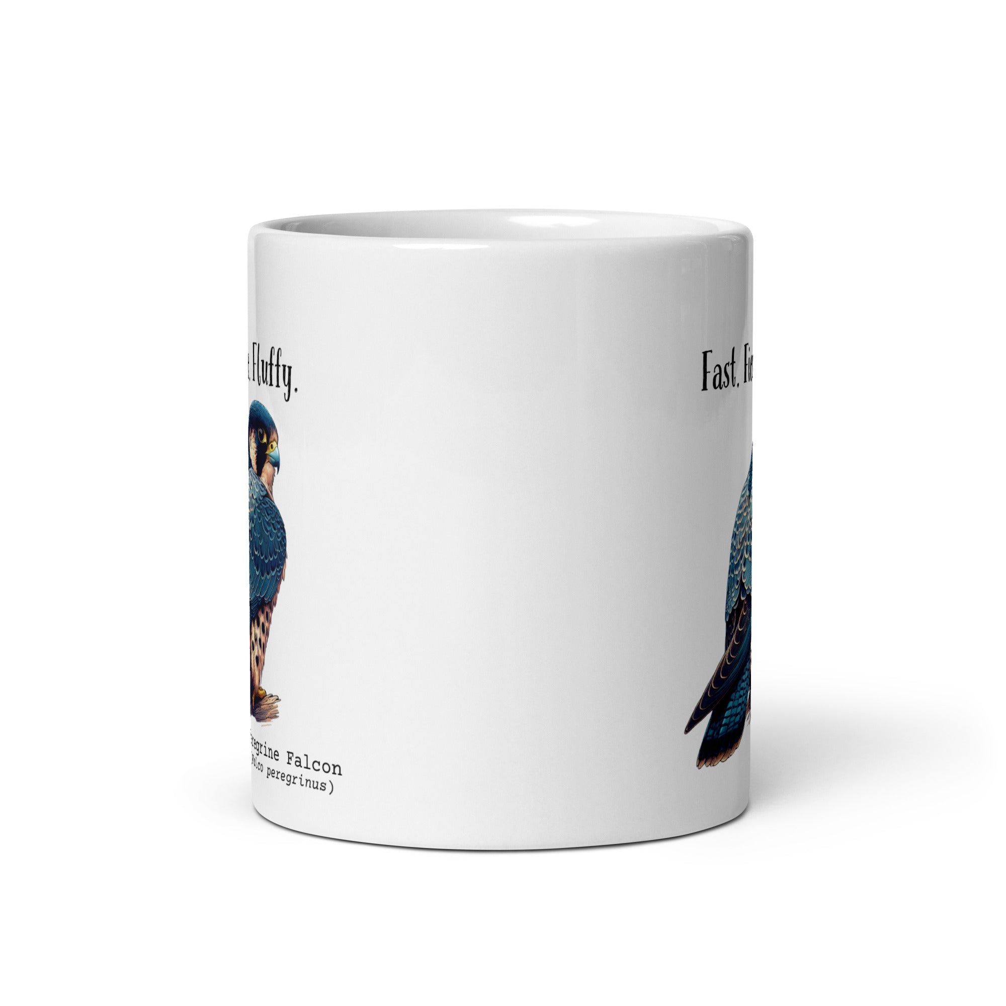 White 11oz mug with the words "Fast. Fierce. Fluffy." above an illustration of a Peregrine Falcon. The Peregrine's common and scientific names are next to the bird.