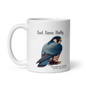 White 11oz mug with the words "Fast. Fierce. Fluffy." above an illustration of a Peregrine Falcon. The Peregrine's common and scientific names are next to the bird.