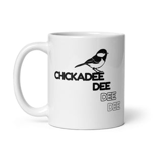 11 oz white Chickadee mug handle to the left.