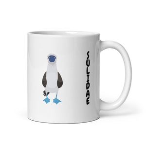 white glossy 11 ounce mug with illustrations of the blue-footed, red-footed and brown booby and the words, "I'm just here for the Sulidae." Mug handle to the right.