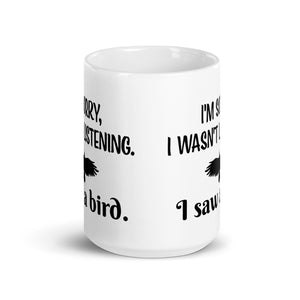 White 15oz mug with the words "I'm Sorry I Wasn't Listening. I Saw a Bird." around the silhouette of a bird flying.