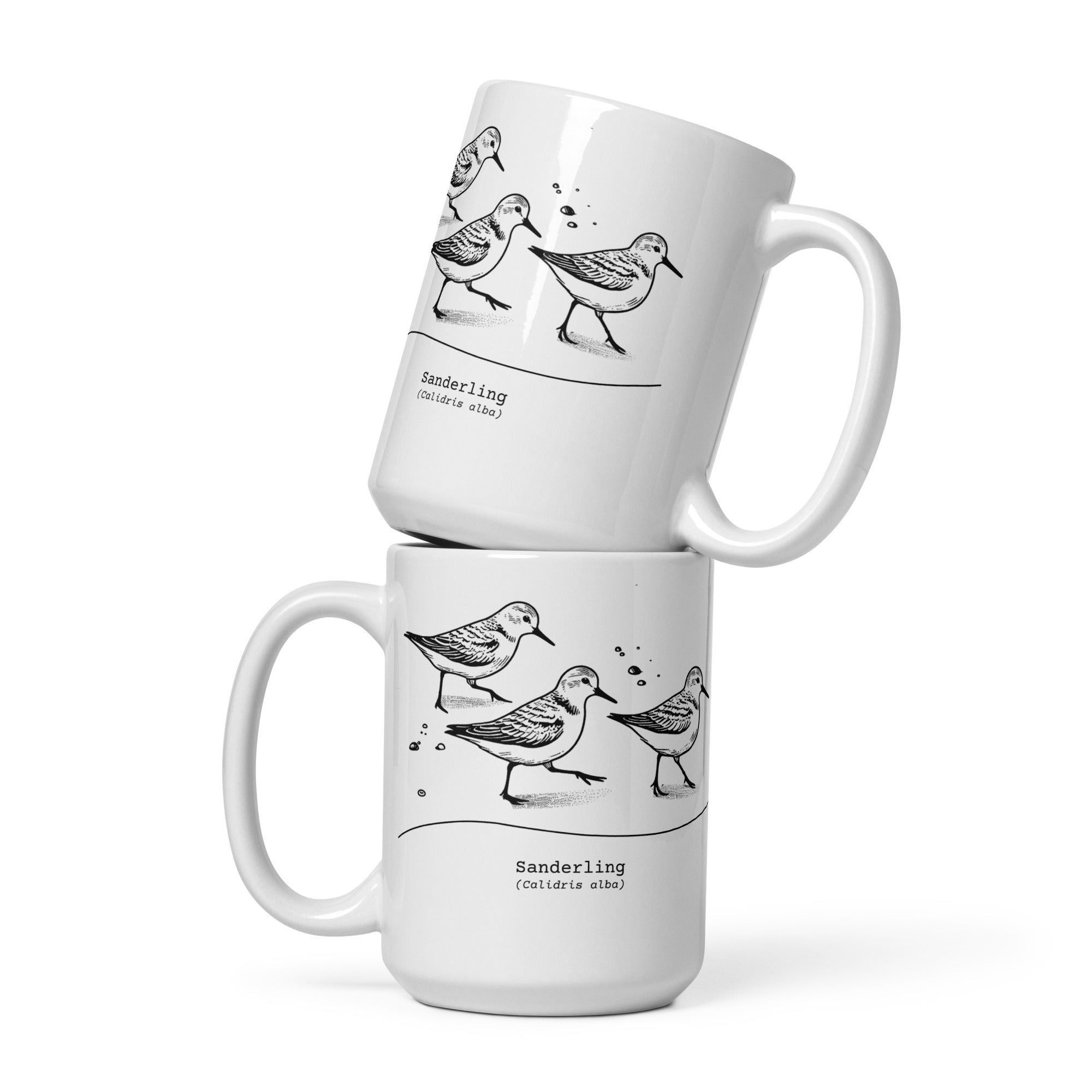 White 15-ounce mug featuring an illustration of a three sanderlings on a beach and the common and scientific names for the bird underneath.