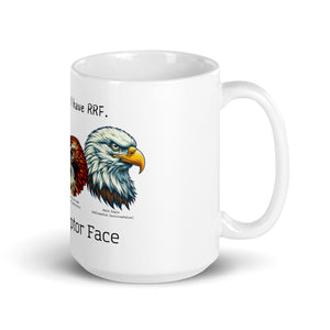 White 15oz mug with illustrations of a Great Horned Owl, Peregrine, Red-Tailed Hawk and Bald Eagle and the words "I'm Not Angry, I have RRF. Resting Raptor Face" above and below the birds..