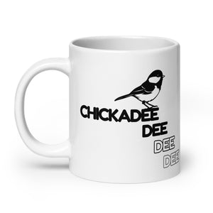 20 oz white Chickadee mug with handle to the left.