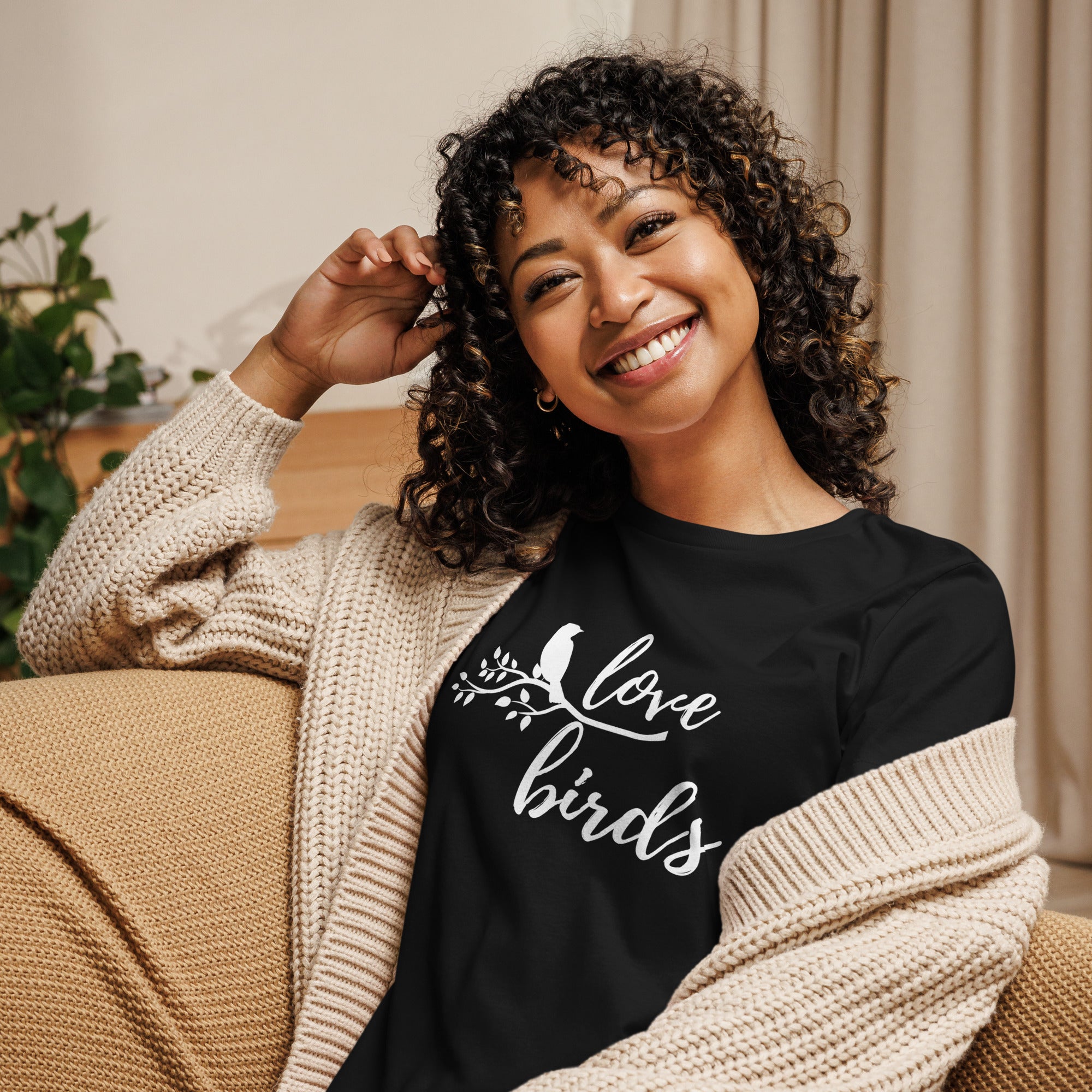 Black women's birding t-shirt with the words Love birds and a graphic of a bird on a branch in white.