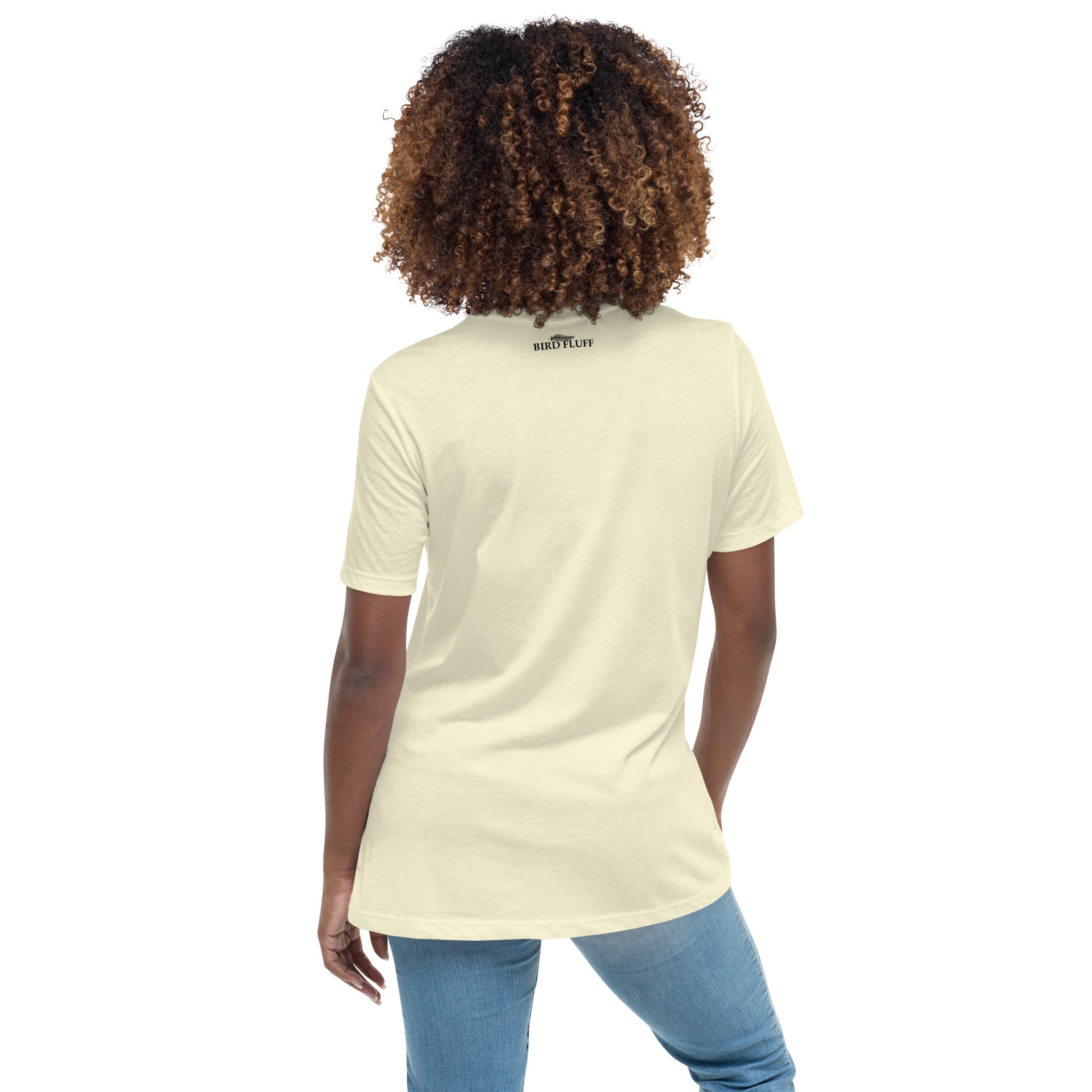 Light yellow women's bird t-shirt with the words I'm sorry I wasn't listening, I saw a bird. And a graphic of a bird flying. Rear of shirt with small brand logo near collar.