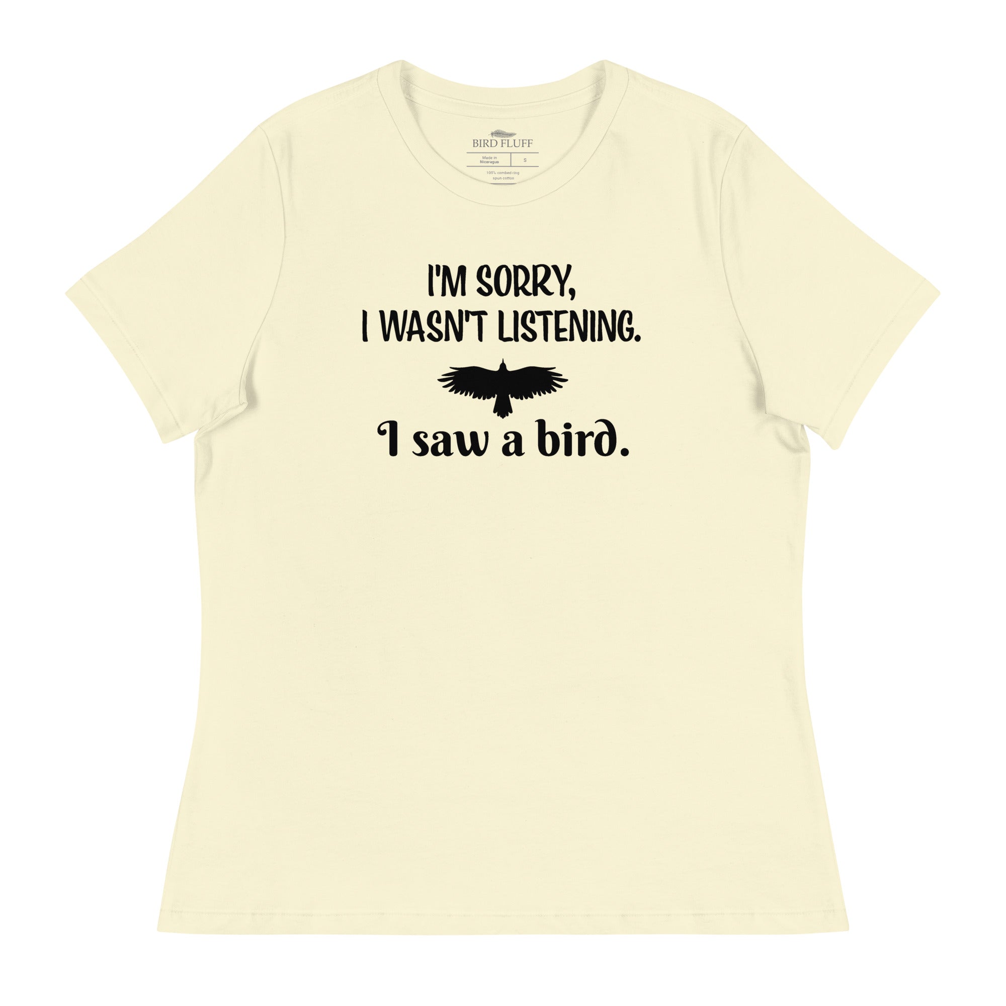 Light yellow women's bird t-shirt with the words I'm sorry I wasn't listening, I saw a bird. And a graphic of a bird flying.