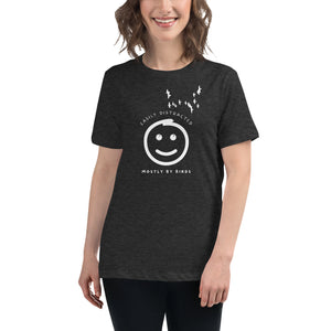 Dark gray heather women's bird t-shirt with a smiley face looking up and to the side at a flock of birds surrounded by the words, "Easily Distracted" above and, "Mostly by Birds" below. Worn by a woman.