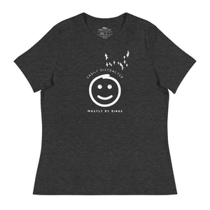 Dark gray heather women's bird t-shirt with a smiley face looking up and to the side at a flock of birds surrounded by the words, "Easily Distracted" above and, "Mostly by Birds" below.