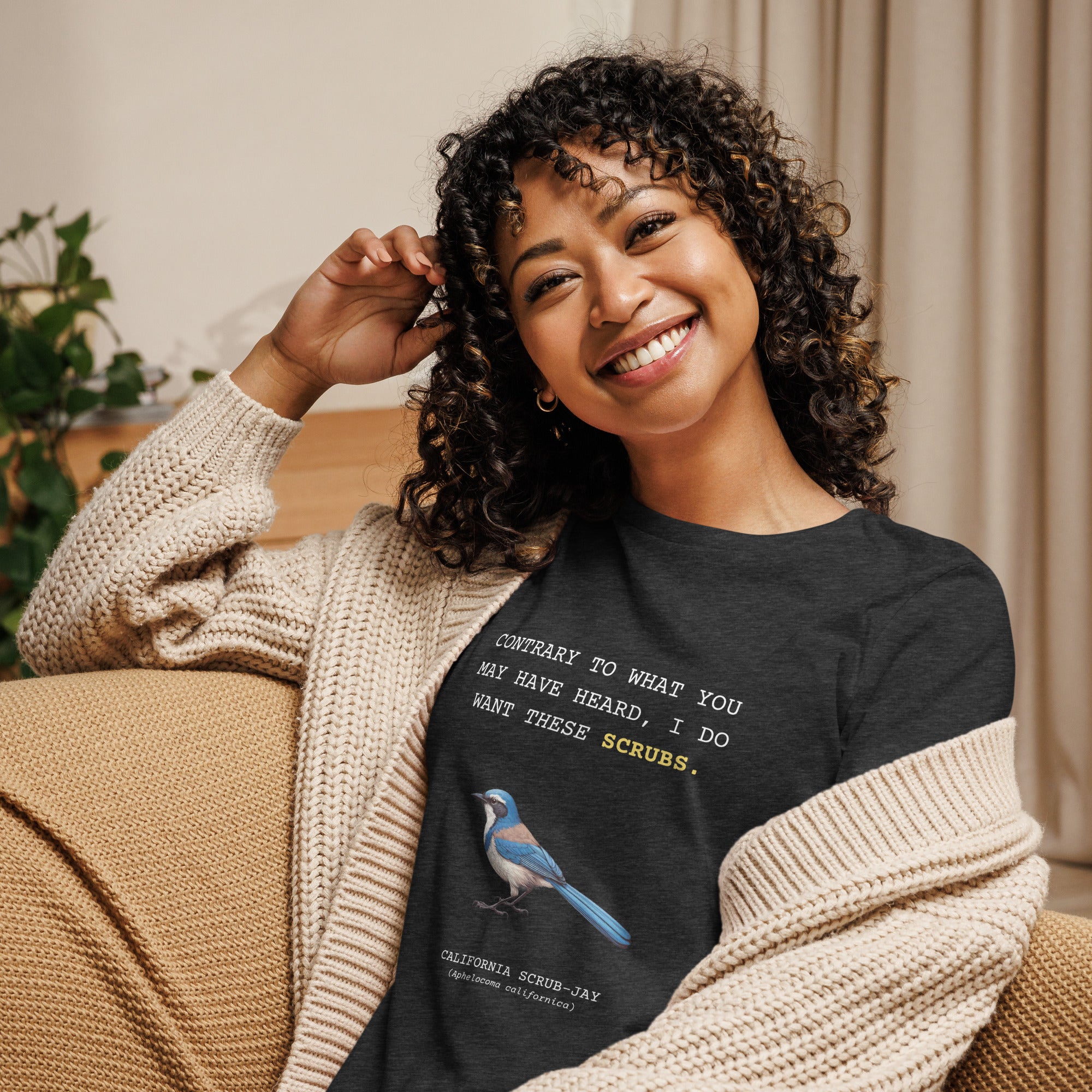 Navy blue women's bird shirt with the words I want these scrubs on the front above an illustration of a California scrub-jay.