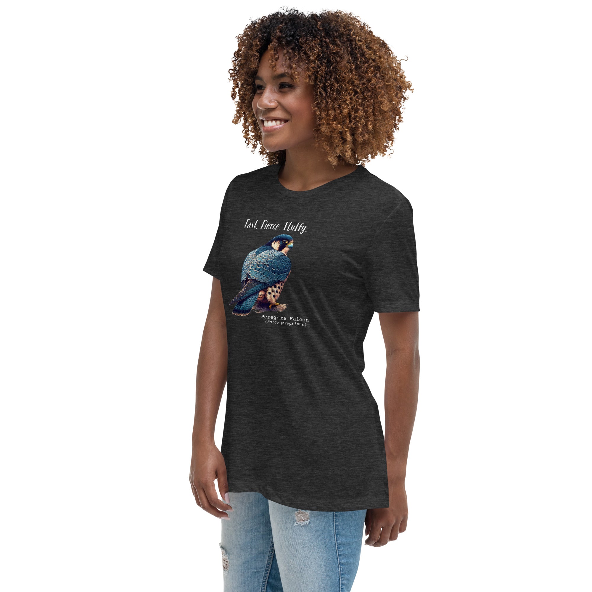 A dark heather gray women's bird shirt with the words, "Fast. Fierce. Fluffy" above an illustration of a peregrine falcon. Worn by a woman.