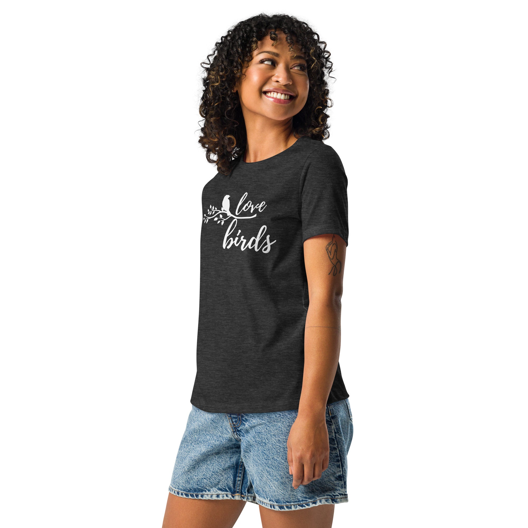 Dark heather gray women's birding t-shirt with the words Love birds and a graphic of a bird on a branch in white. Worn by a woman.