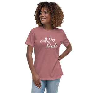 Heather mauve women's birding t-shirt with the words Love birds and a graphic of a bird on a branch in white. Worn by a woman.