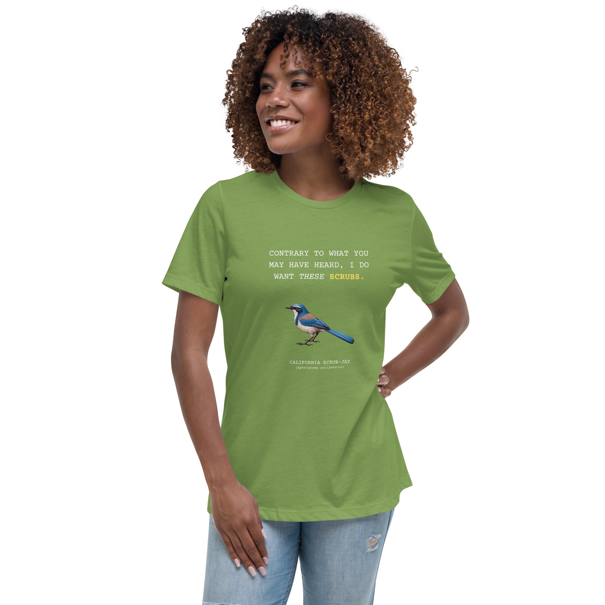 Leaf green women's bird shirt with the words I want these scrubs on the front above an illustration of a California scrub-jay. Worn by a woman.