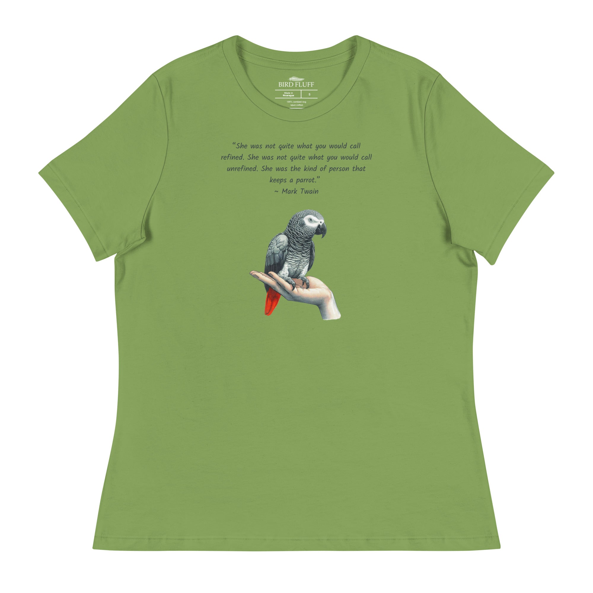 Green bird shirt with a Mark Twain woman who keeps parrot quote and a illustration of an african grey parrot perched on a hand beneath. 