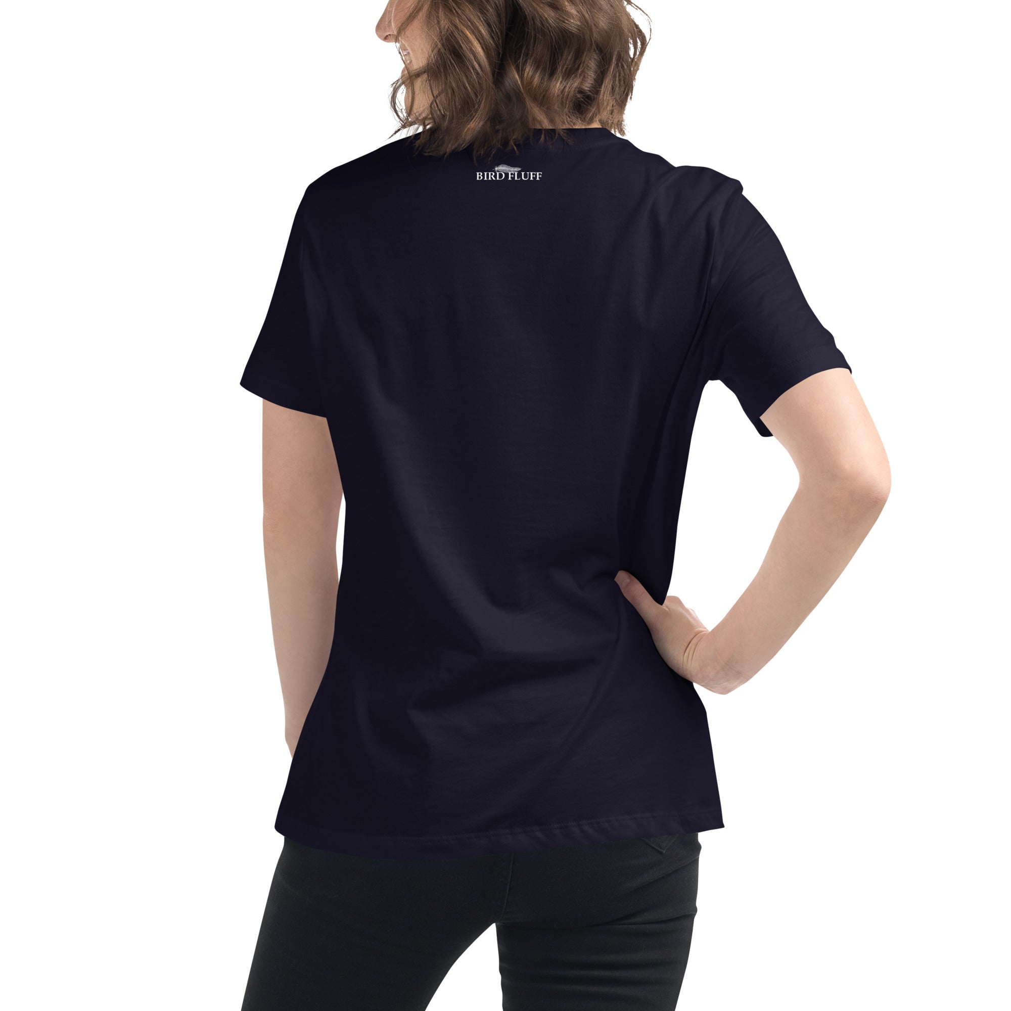 Navy blue women's bird t-shirt with the words I'm sorry I wasn't listening, I saw a bird. And a graphic of a bird flying. Worn by a woman. Rear of shirt with small brand logo at collar.