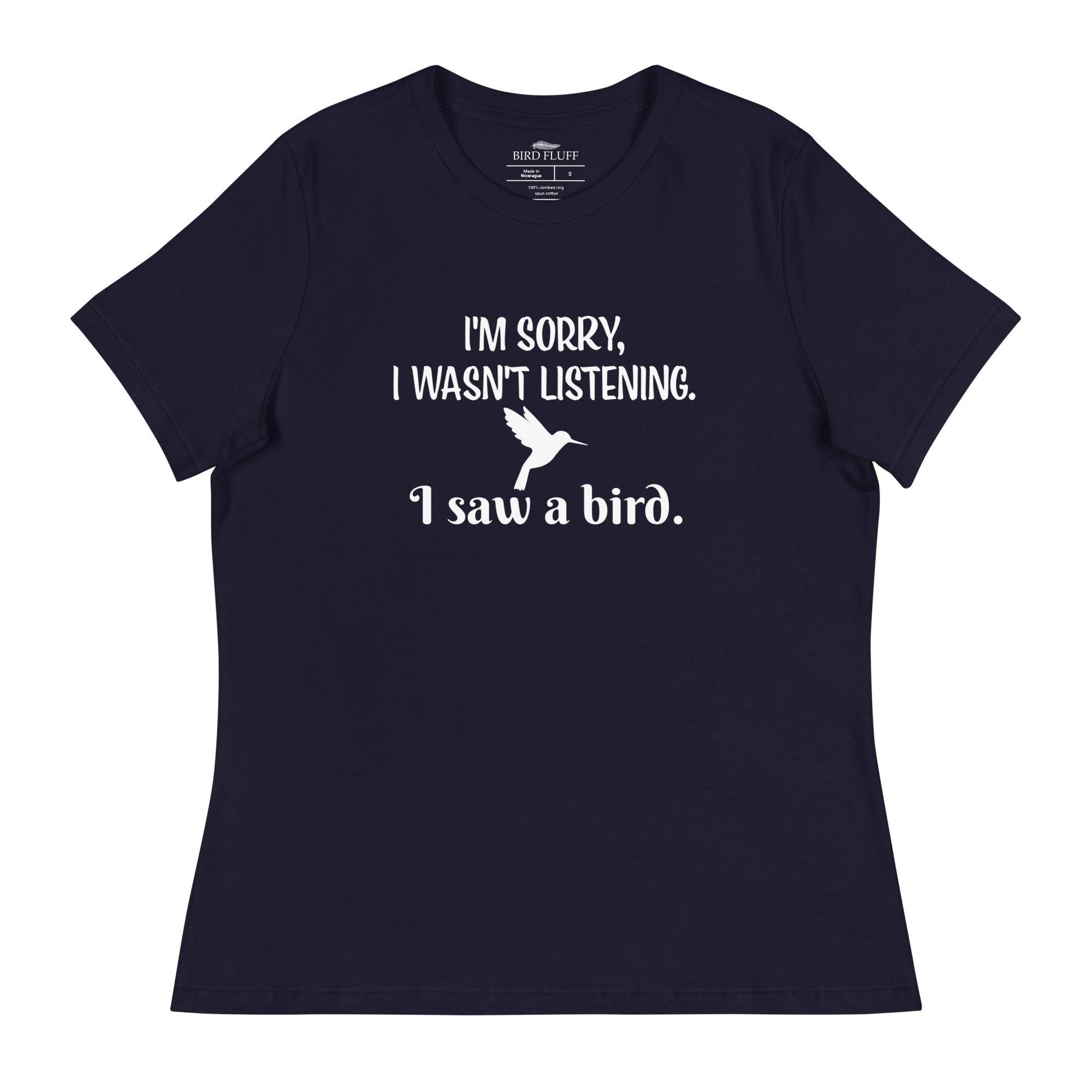 Navy blue women's relaxed crew neck bird t-shirt with the words I'm sorry I wasn't listening, I saw a bird. And a graphic of a hummingbird flying. 