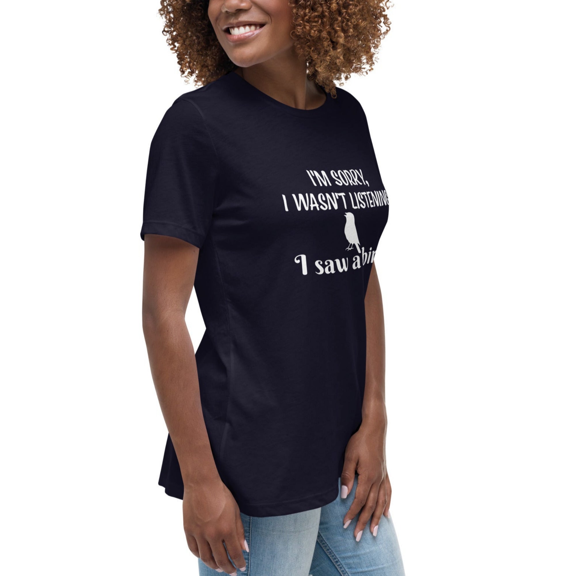 Navy blue women's relaxed crew neck bird t-shirt with the words I'm sorry I wasn't listening, I saw a bird. And a graphic of a songbird.