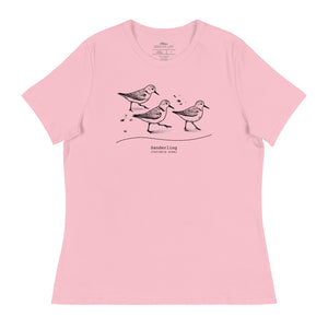 Light pink bird shirt featuring an illustration of a three sanderlings on a beach and the common and scientific names for the bird underneath.