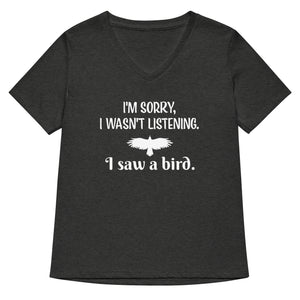 Heather dark grey women's v-neck bird t-shirt with the words I'm sorry I wasn't listening, I saw a bird. And a graphic of a bird flying.