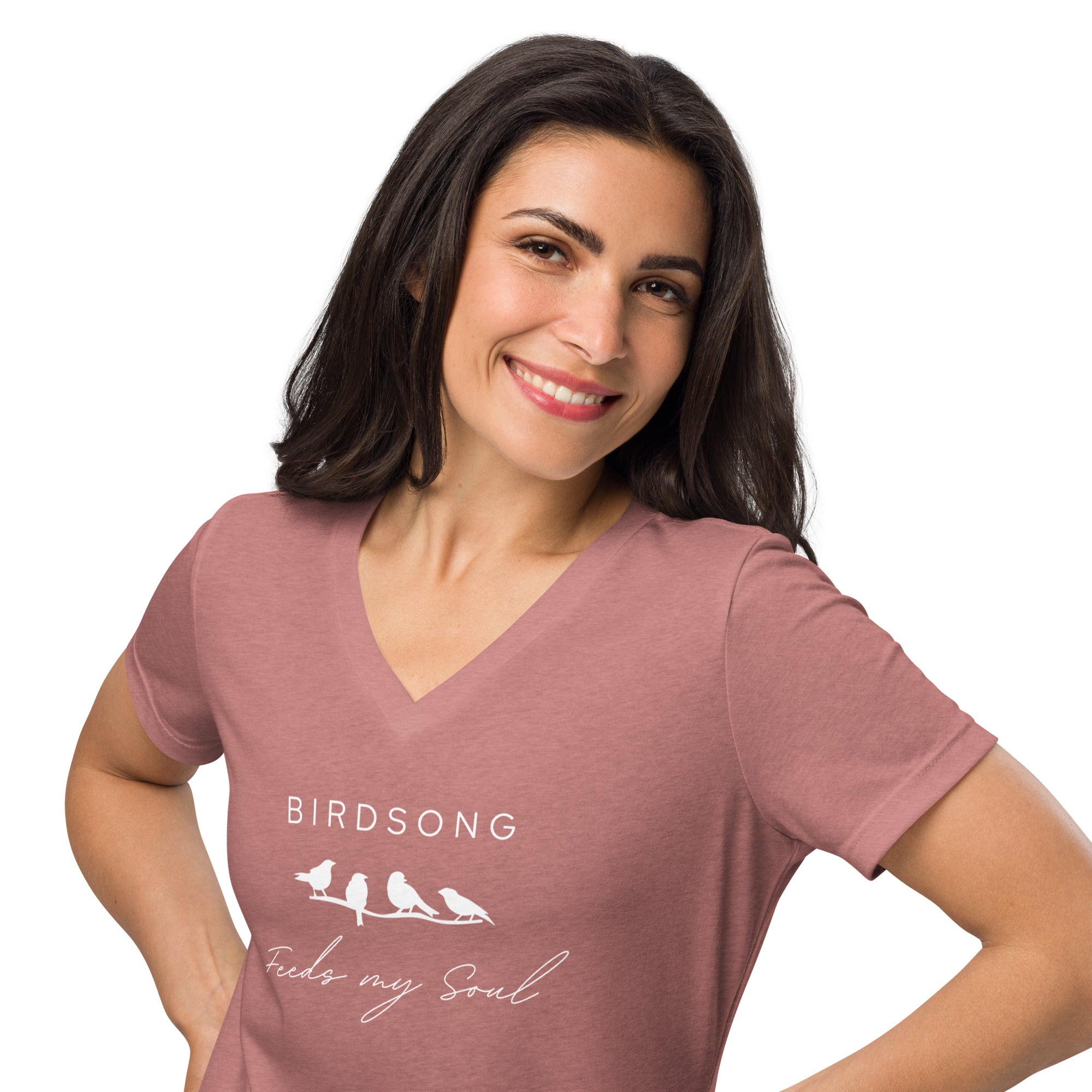 Heathered mauve women's v-neck bird t-shirt with the words Birdsong feeds my soul placed above and below a white graphic of 4 birds on a branch. Worn by a woman.