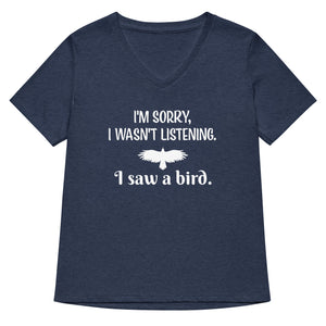 Heather navy women's v-neck bird t-shirt with the words I'm sorry I wasn't listening, I saw a bird. And a graphic of a bird flying.