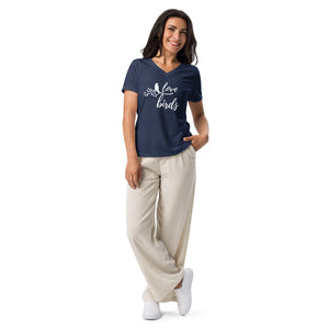 Heather navy blue women's v-neck birding t-shirt with the words Love birds and a graphic of a bird on a branch in white. Worn by a woman.