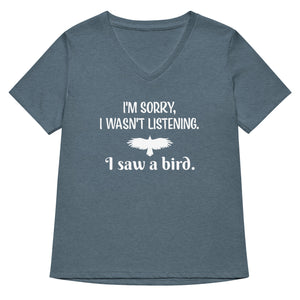 Heather slate blue women's v-neck bird t-shirt with the words I'm sorry I wasn't listening, I saw a bird. And a graphic of a bird flying.