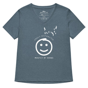 Heathered slate blue women's v-neck bird t-shirt with a smiley face looking up and to the side at a flock of birds surrounded by the words, "Easily Distracted" above and, "Mostly by Birds" below.