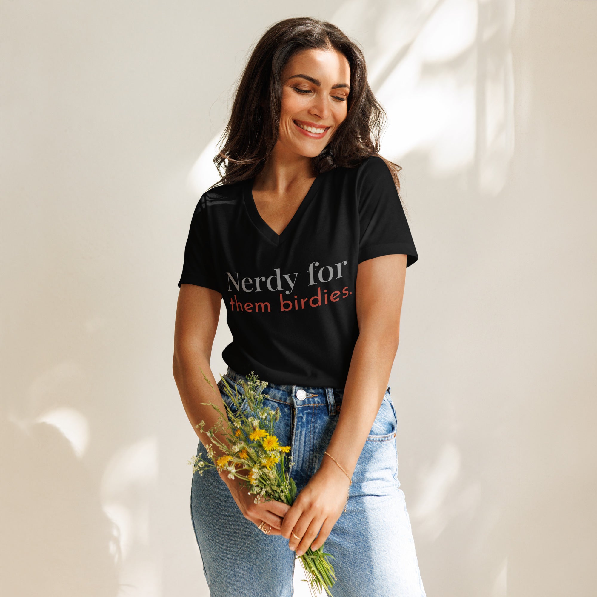 Black women's v-neck bird shirt with the words Nerdy for them birdies on the front in two coordinating fonts and colors.