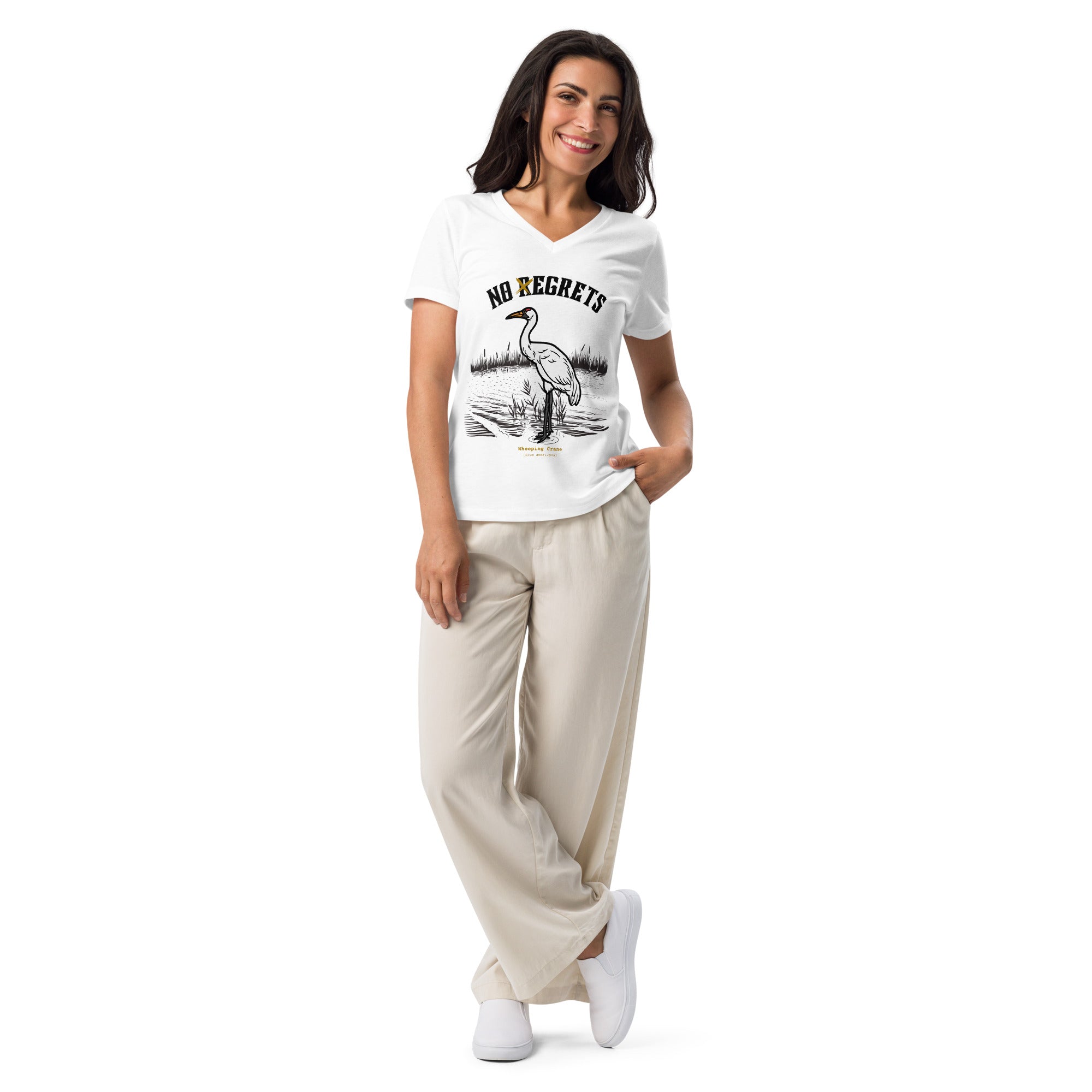 White women's bird shirt featuring a play on the "No Regrets" tattoo that has the "R" crossed out to say "No Egrets" with a Whooping Crane below in a wetland setting. Worn by a woman.