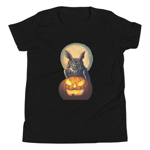 Black youth bird t-shirt with a great horned owl sitting behind a jack-o-lantern with a full moon rising behind.