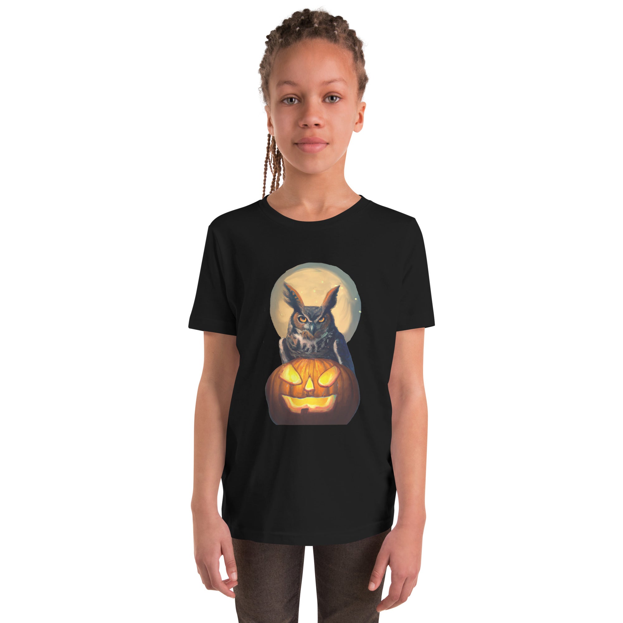 Black youth bird t-shirt with a great horned owl sitting behind a jack-o-lantern with a full moon rising behind.