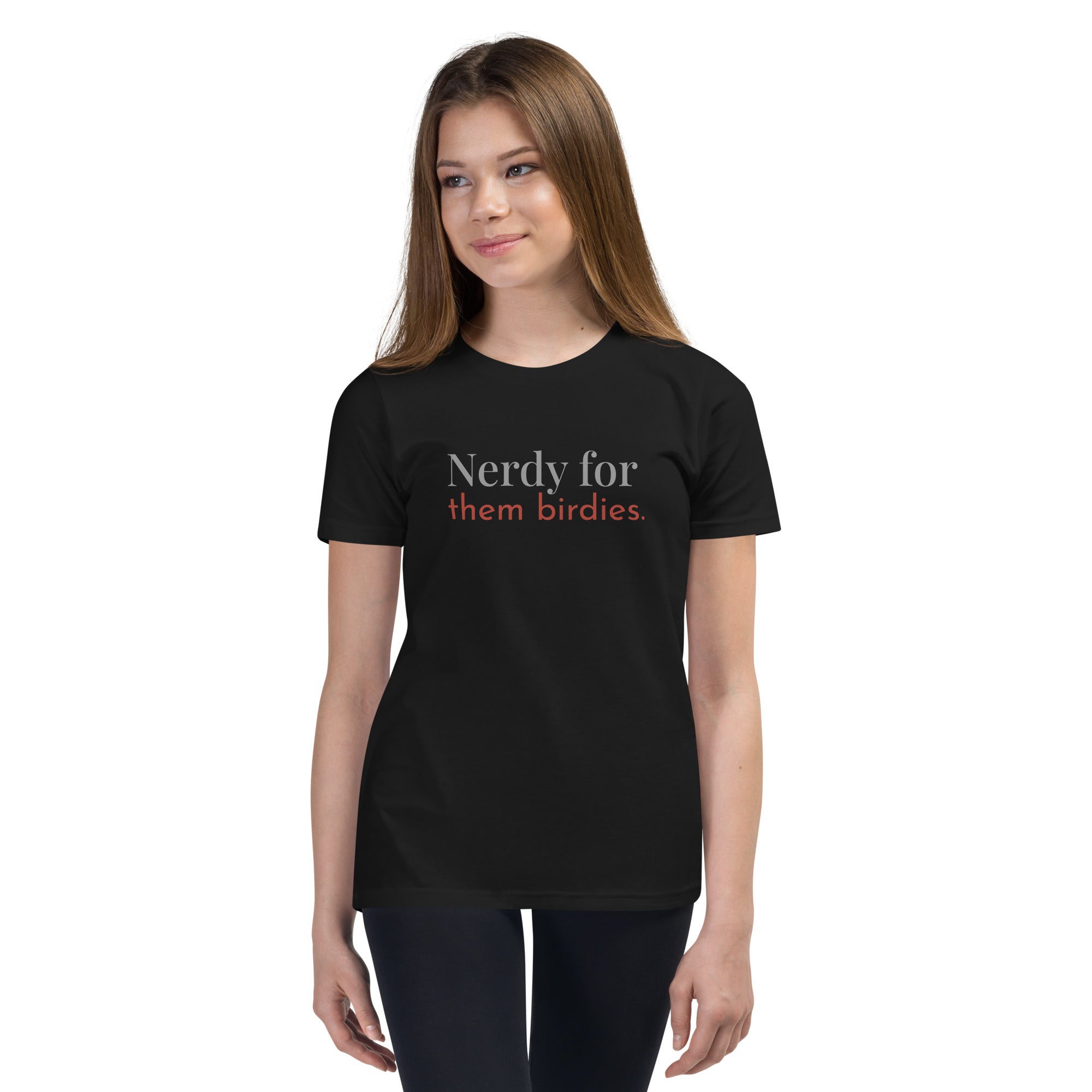 Black youth bird shirt with the words Nerdy for them birdies on the front in two coordinating fonts and colors. Worn by a girl.