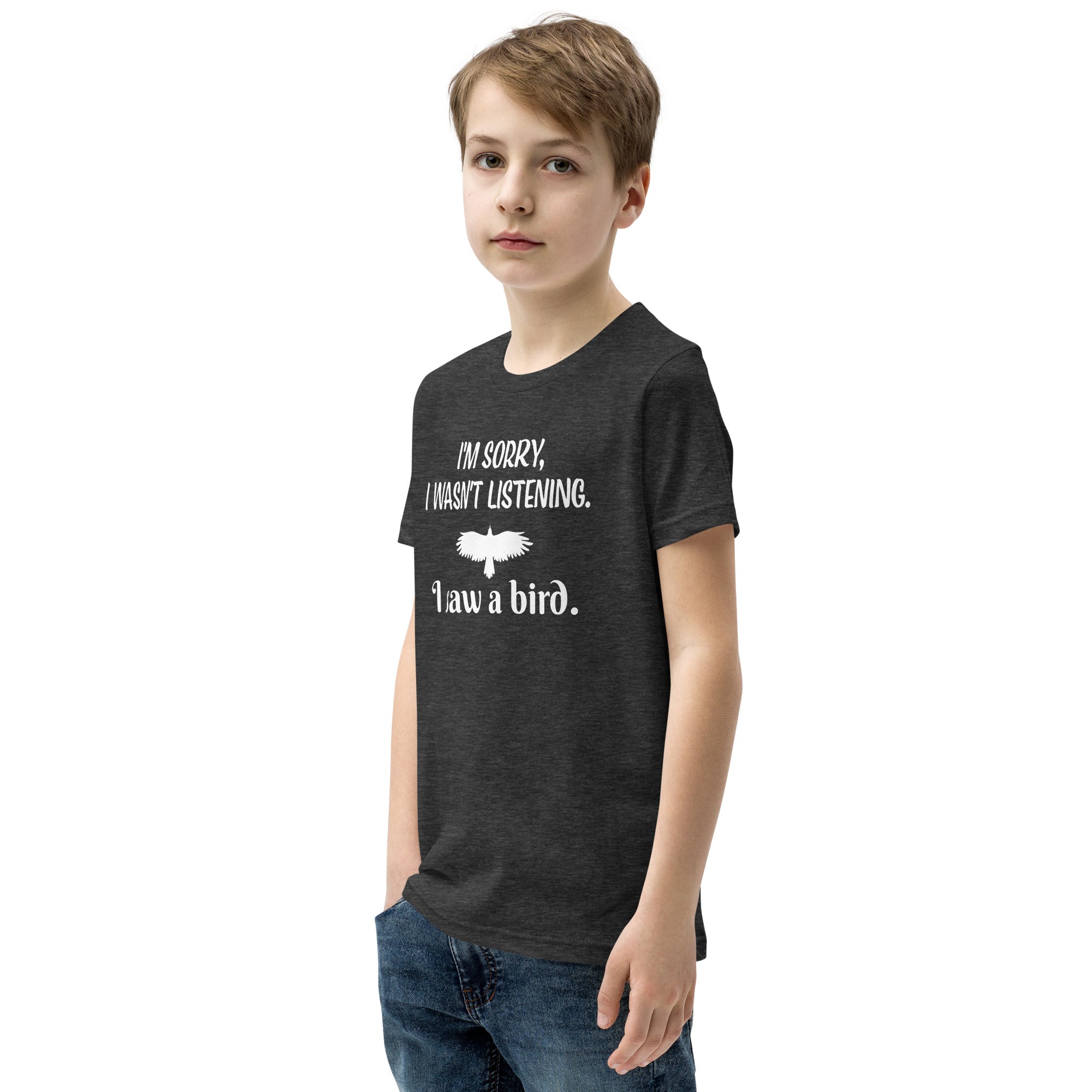 Dark heather grey youth bird t-shirt with the words I'm sorry I wasn't listening, I saw a bird. And a graphic of a bird flying.