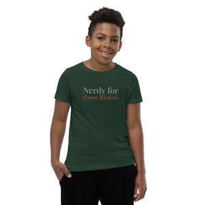 Forest green youth bird shirt with the words Nerdy for them birdies on the front in two coordinating fonts and colors. Worn by a boy.