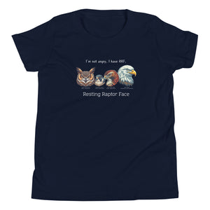 A navy youth bird shirt with a great horned owl, a peregrine falcon, a red-tailed hawk and a bald eagle. The shirt has text that says, I'm not angry, I have RRF. Resting Raptor Face.