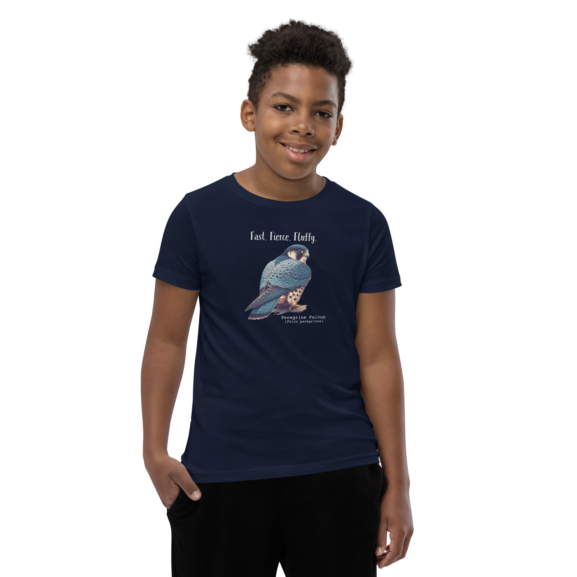 A navy blue youth bird shirt with the words, "Fast. Fierce. Fluffy" above an illustration of a peregrine falcon. Worn by a boy.