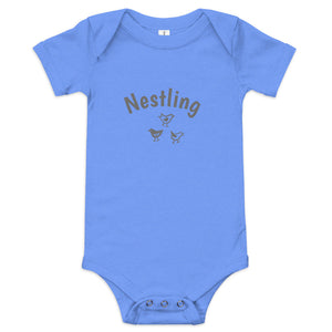 Heather blue one-piece baby suit with the word Nestling on the front above three small birds in dark grey.