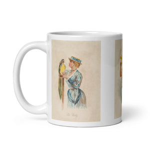 Bird mug. White coffee mug with three vintage remastered illustrations of girls in historical dress from the 1890s with birds.